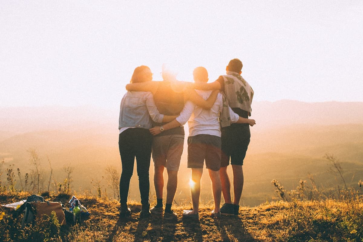 Friends sharing a moment together in the evening sun